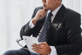 Businessman thinking on a chair